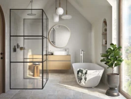 Une baignoire Theano Curved Edition dan une salle de bains claire Une baignoire blanche Theano Curved Edition dans une salle de bains lumineuse avec une fenêtre allant jusqu’au sol.