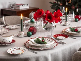 A cheerful holiday table adorned with Toys Delight dinnerware and exquisite glassware, ideal for celebrating the season