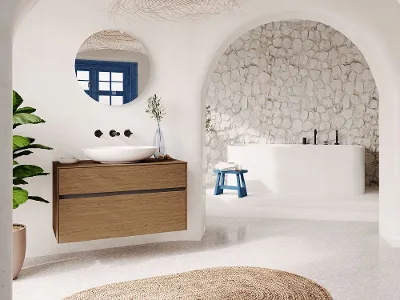 A white bathroom with an archway and a white Loop & Friends washbasin.