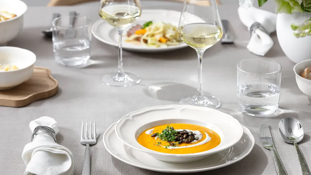 Close up shot of Manoir soup bowl on dinner table.