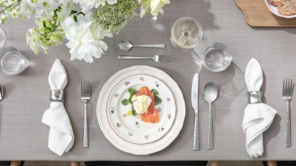Close-up of Petite Fleur and Manoir plates styled together in a mix-and-match setting