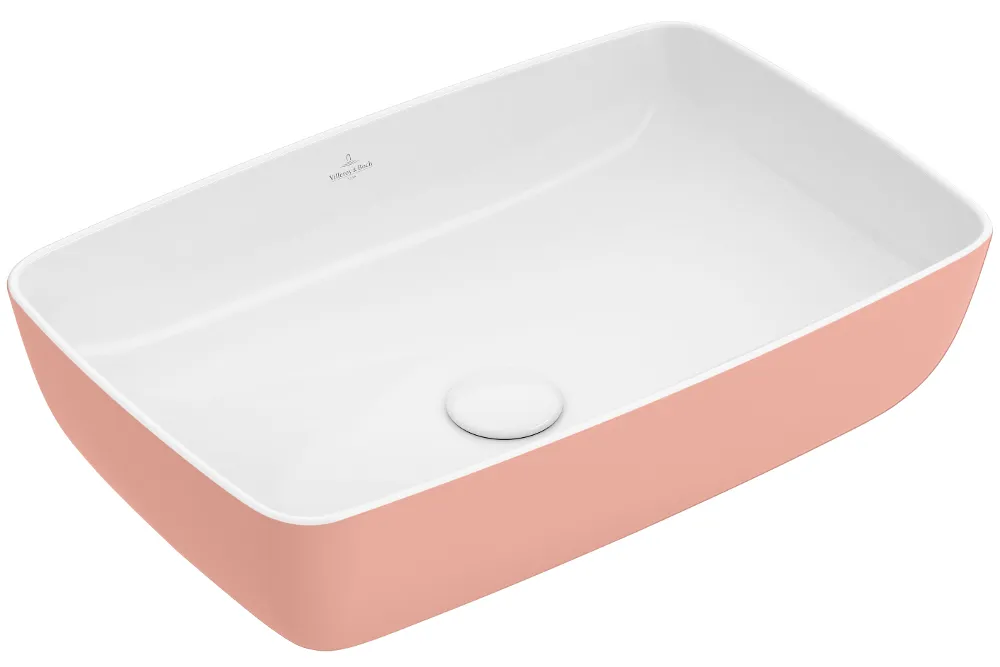 Rectangular white ceramic washbasin with a light pink outer surface and a drain positioned in the centre.