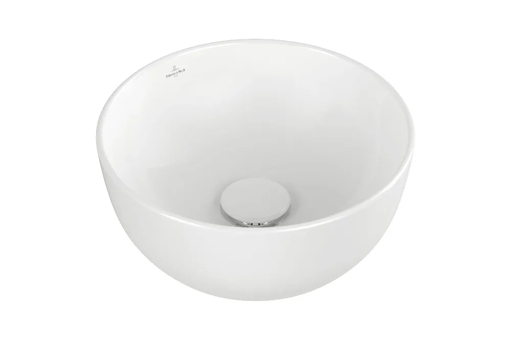 Un lavabo Artis blanc rond sur un fond blanc