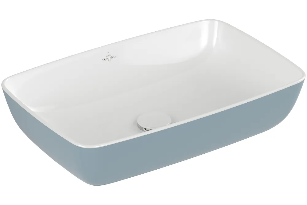Rectangular white ceramic washbasin with a light blue outer surface and a drain positioned in the centre.
