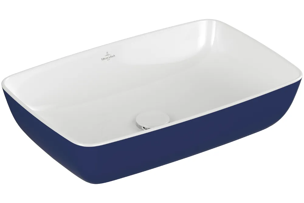 Rectangular white ceramic washbasin with a blue outer surface and a drain positioned in the centre.