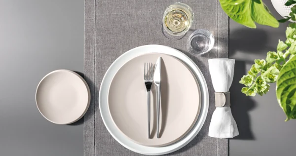 A table set with Villeroy & Boch NewMoon tableware and cutlery.