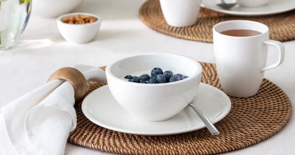 Breakfast table with artesano bowl with yogurt and blueberries