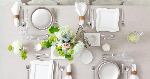 Modern NewWave table setting styled with NewMoon dinnerware for a contemporary dining look.