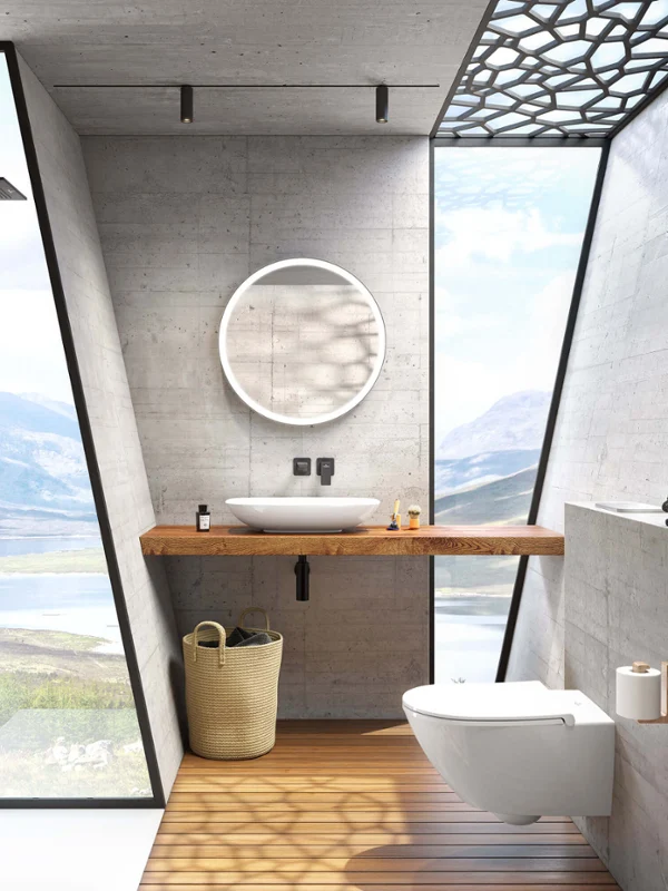 Modern bathroom with concrete walls, a large window with a view of a lake, a round Subway 3.0 mirror and a white Loop & Friends surface-mounted washbasin