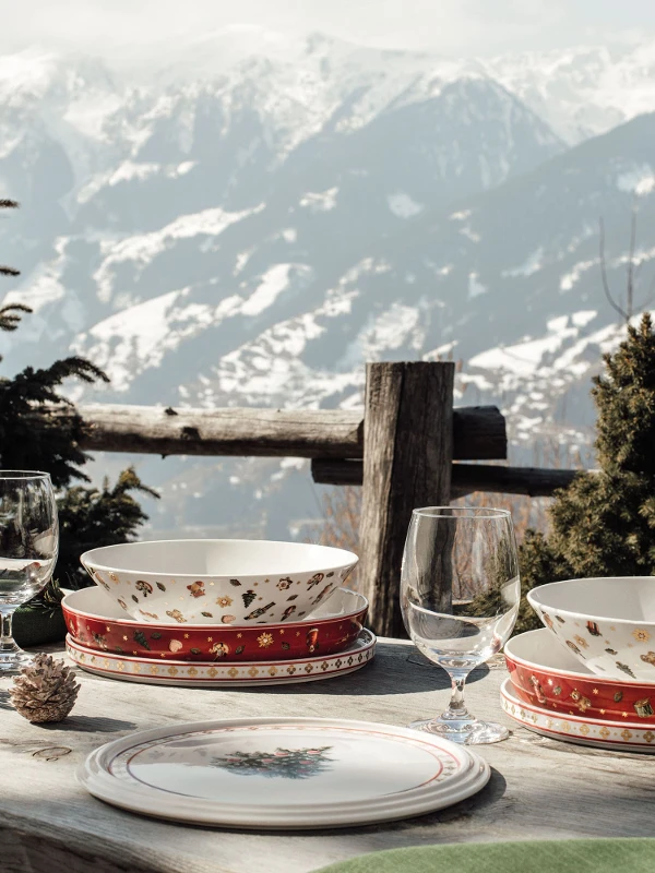 A table with a view of the mountains, set with the Toy’s Delight La Boule from Villeroy & Boch.