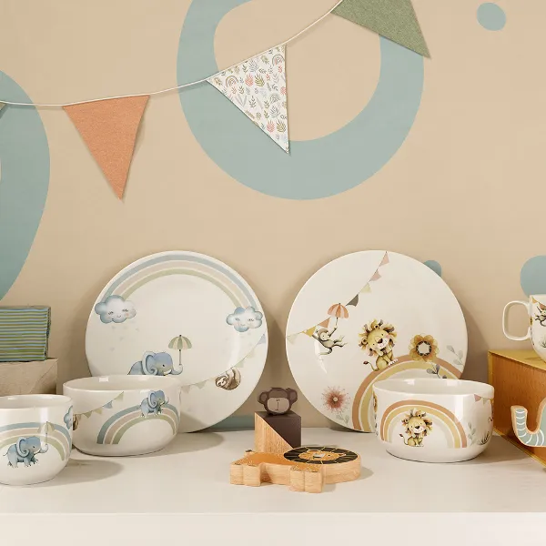 Boho Kids complete children's crockery sets as gifts with bunting in the background and a wooden toy.