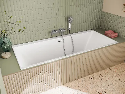Subway 3.0 bath tap with hand shower A Subway 3.0 bath tap on a bath with a hand shower in front of a green tiled wall
