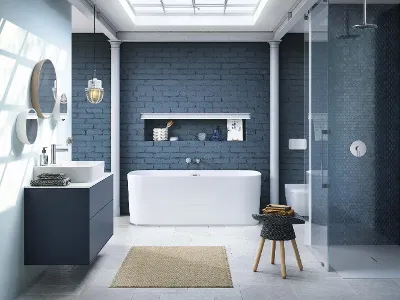 Vasca da bagno free-standing bianca, lavabo, doccia smaltata in un moderno bagno blu Bagno moderno con parete in mattoni blu, vasca bianca free-standing, doccia smaltata, lavabo con specchi rotondi e un piccolo sgabello. La luce del sole entra attraverso un lucernario.