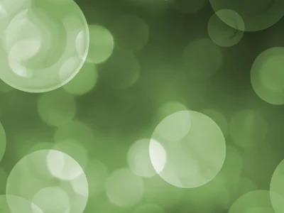 Easter Sale: Green Bokeh Background Green background with soft, blurred plates creating a bokeh effect.