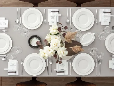 Table for 6 people set with Royal dinnerware Table setting with white plates from Villeroy & Boch Royal, stylish glassware and elegant silver flatware on a beige tablecloth. The centerpiece features white roses with brown accents. Each seat comes with a small menu and a napkin.