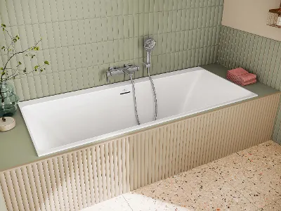 Vasca da bagno Subway 3.0 bianca in un bagno verde Una vasca da bagno Subway 3.0 bianca in un bagno con pareti verdi.