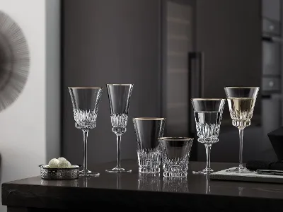 Elegant Grand Royal glasses on a kitchen counter Elegant Grand Royal glasses on a kitchen counter in a modern kitchen with dark cabinets in the background.