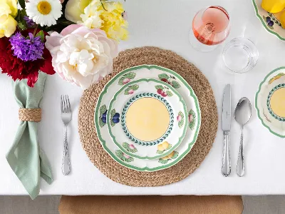 Aerial view of French Garden plate paired with Mademoiselle flatware.