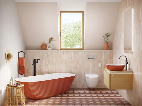 Rust-red Villeroy & Boch Theano bath A modern bathroom with a red freestanding bath, a wooden washstand with a black washbasin, a wall-mounted toilet