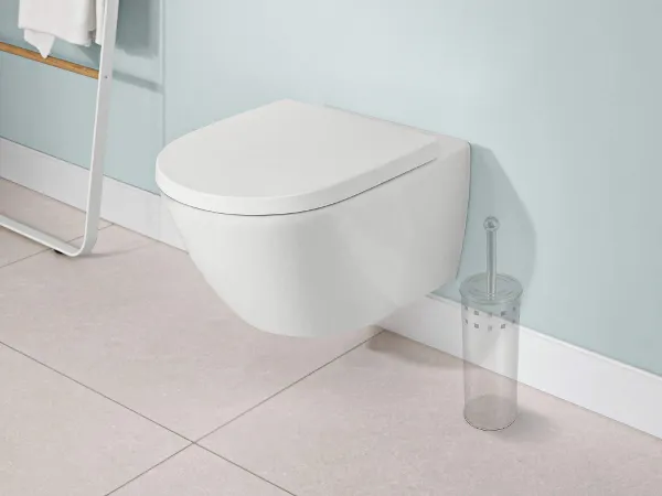 Subway 3.0 toilet with the outlines of a toilet brush holder A modern bathroom with a wall-mounted Subway 3.0 toilet next to a minimalist towel ladder and the outlines of a toilet brush holder