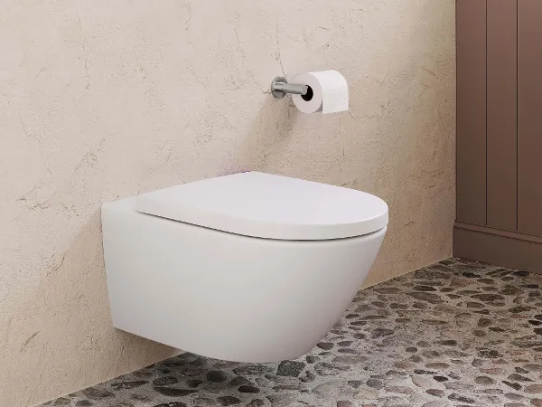 Subway 3.0 WC mit Drückerplatte Modernes Wand-WC mit Drückerplatte in einem Badezimmer mit strukturierten Wänden und Steinboden