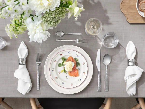 Close-up of Petite Fleur and Manoir plates styled together in a mix-and-match setting