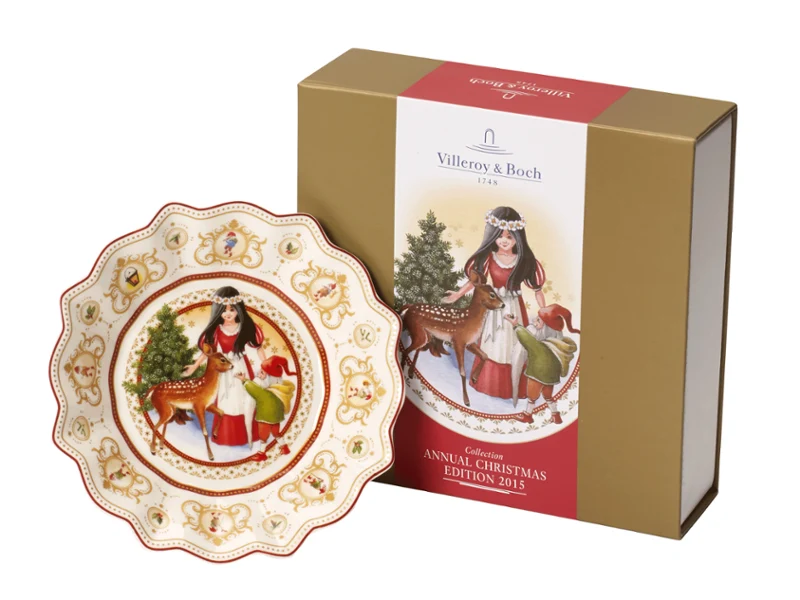 Annual Christmas Edition 2015 Decorative plate with a Christmas motif of a girl and a deer, pictured next to the matching gift box.