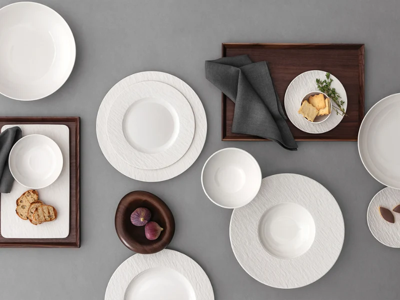 Manufacture ice collection picture with some plate and bowls with bread on it stand on a grey background 