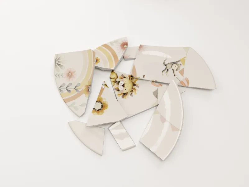 Children's plates from the Boho Kids collection broken into several pieces scattered over a white surface.