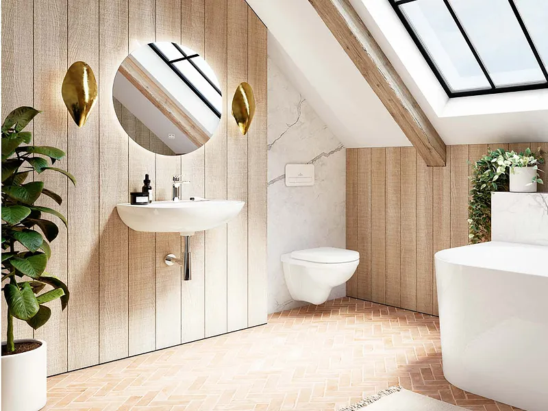 Une salle de bains moderne et lumineuse avec des lavabos muraux O.novo de Villeroy & Boch. Une grande lucarne et une plante en pot ainsi que des notes de bois mettent en valeur la salle de bains de manière décorative.