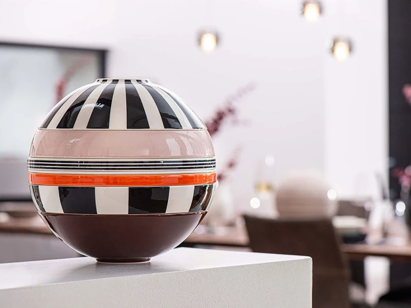 There is a striped La Boule Memphis from Villeroy & Boch on a table in the dining room.