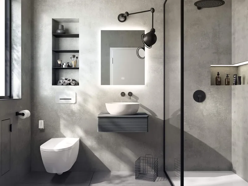 Lavabo Artis bianco in un bagno in stile industrial con pareti in cemento.