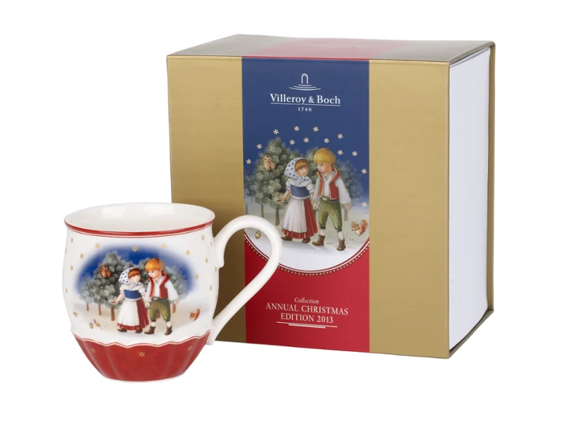 Annual Christmas Edition 2013 A ceramic mug with a winter landscape next to the matching gift box with the same design.