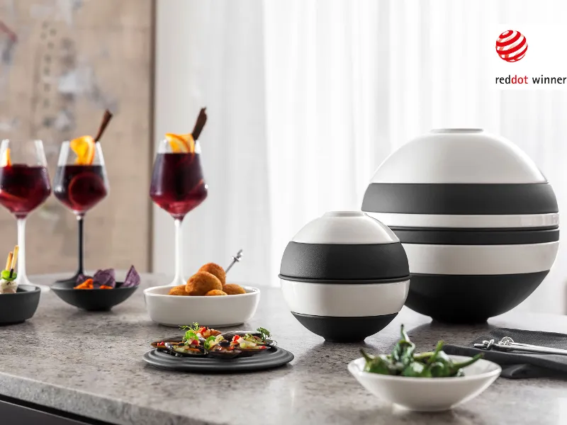 A dining table with appetizers served, arranged in La petite Boule next to the La Boule and Manufacture wine glasses.