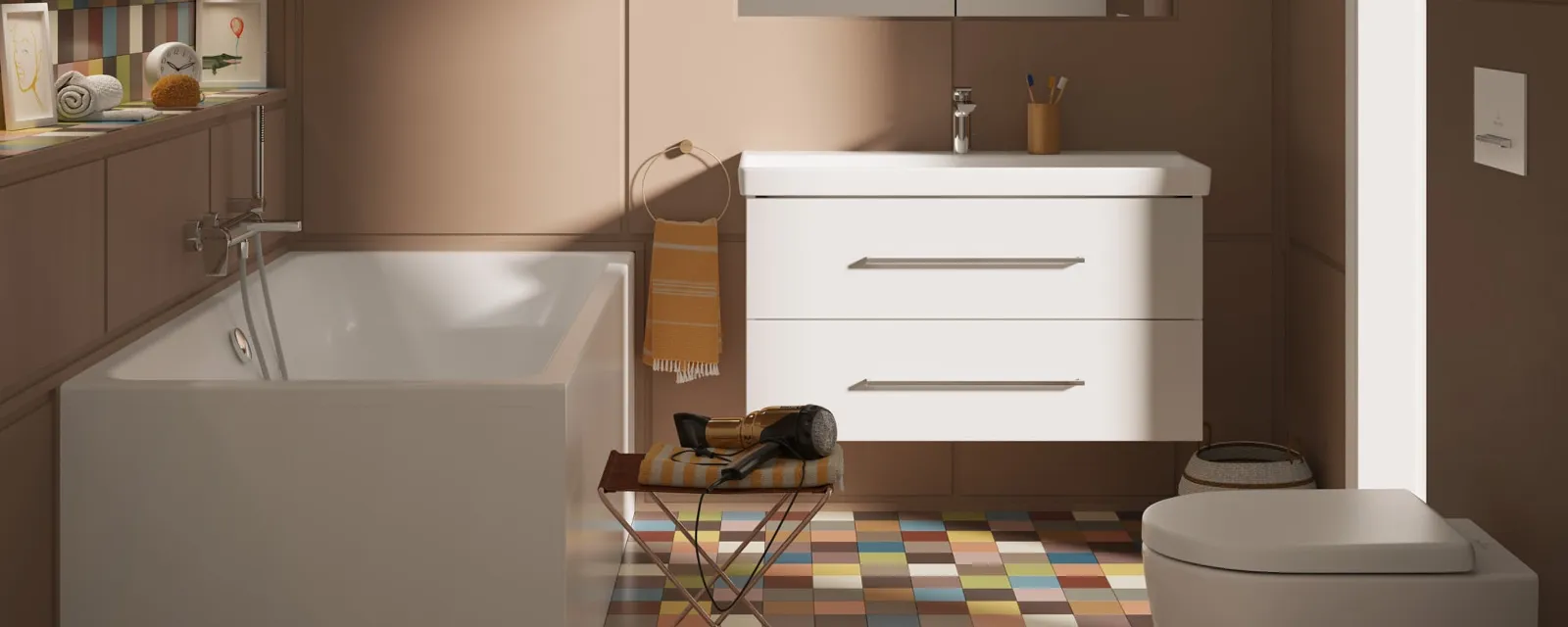 Bathroom with a white bath, a toilet and a washbasin from the Avento collection A modern bathroom with a bath, a white washbasin with a mirror and a wall-mounted toilet. The room has brown panelled walls, colourful floor tiles and two hanging lamps.