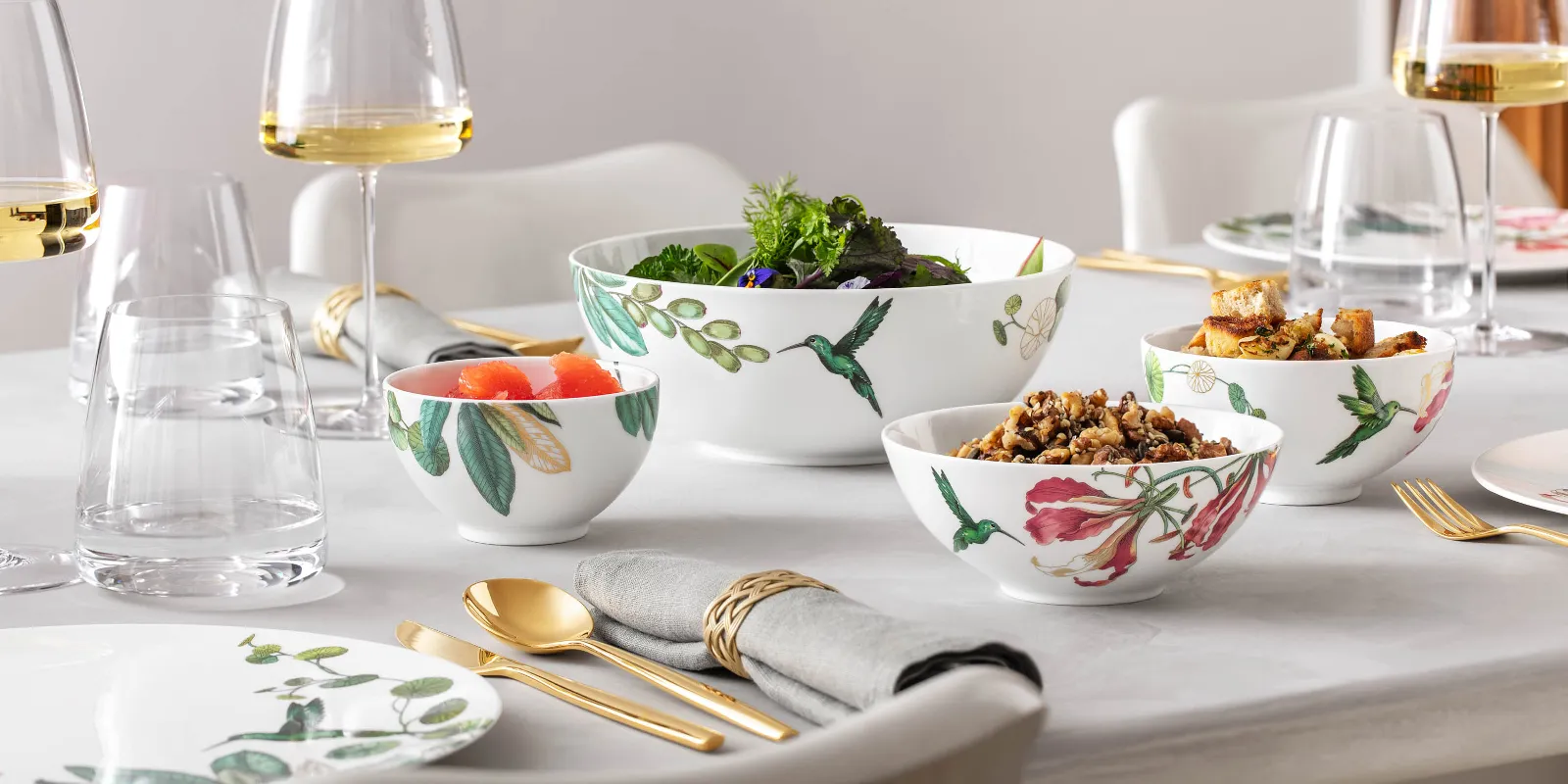 An elegantly laid dining table with Avarua crockery and MetroChic glasses with white wine.