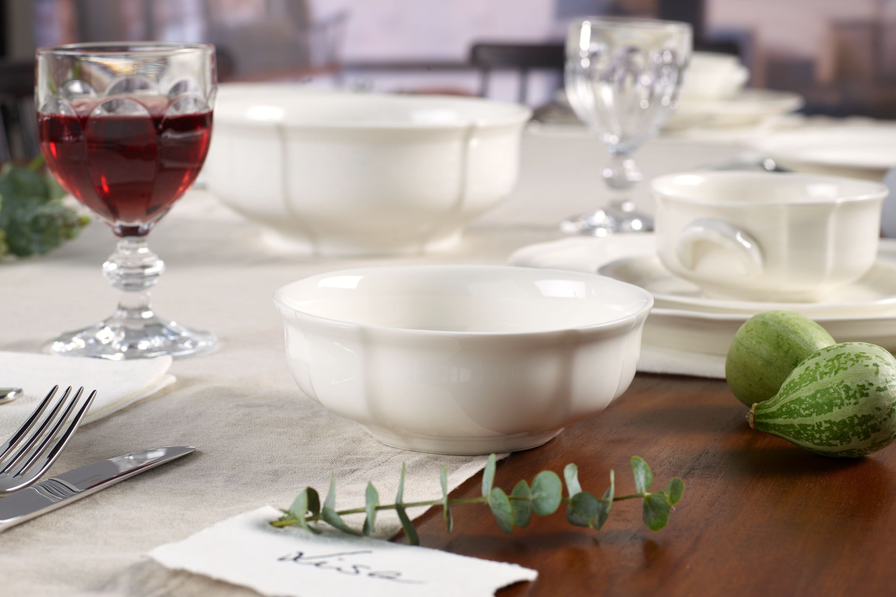 Manoir white porcelain bowl on a wood table 